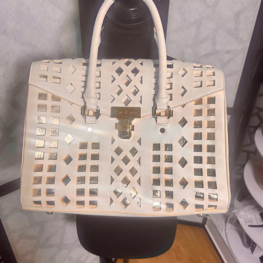 Bebe cream laser-cut satchel gold-tone hardware & turn-lock closure. Like new!